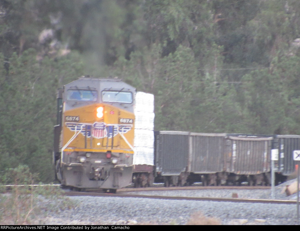 UP 6874 pushes an eastbound through San Timiteo Canyon